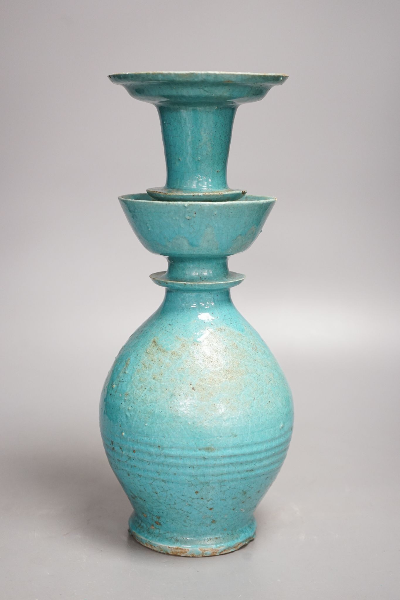 A Persian turquoise glazed huqqa base, 17th century or later, 33cm